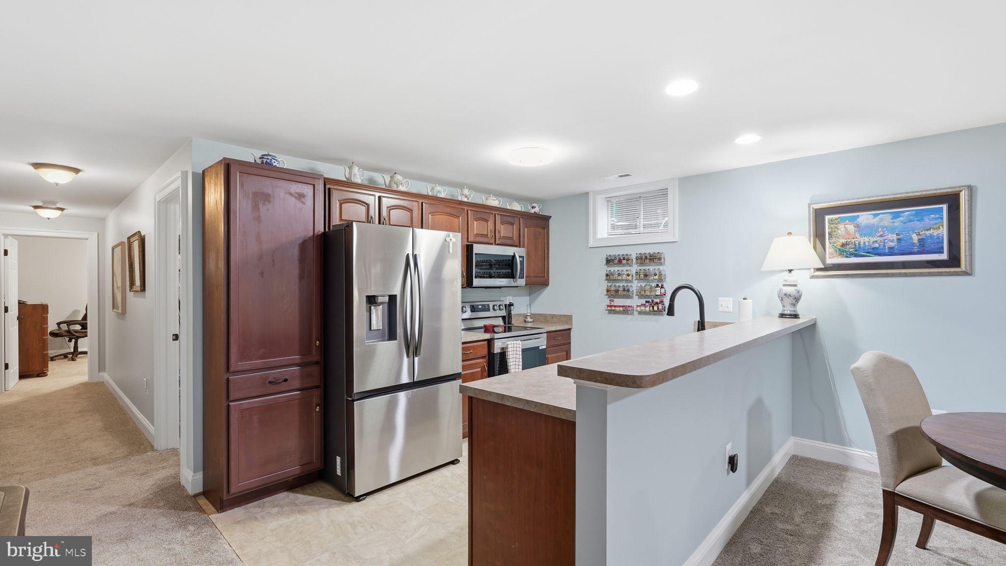 15613 Thoroughfare Road Gainesville, VA 20155 - Photo 42 of 63 a kitchen with stainless steel appliances granite countertop a refrigerator and a stove top oven
