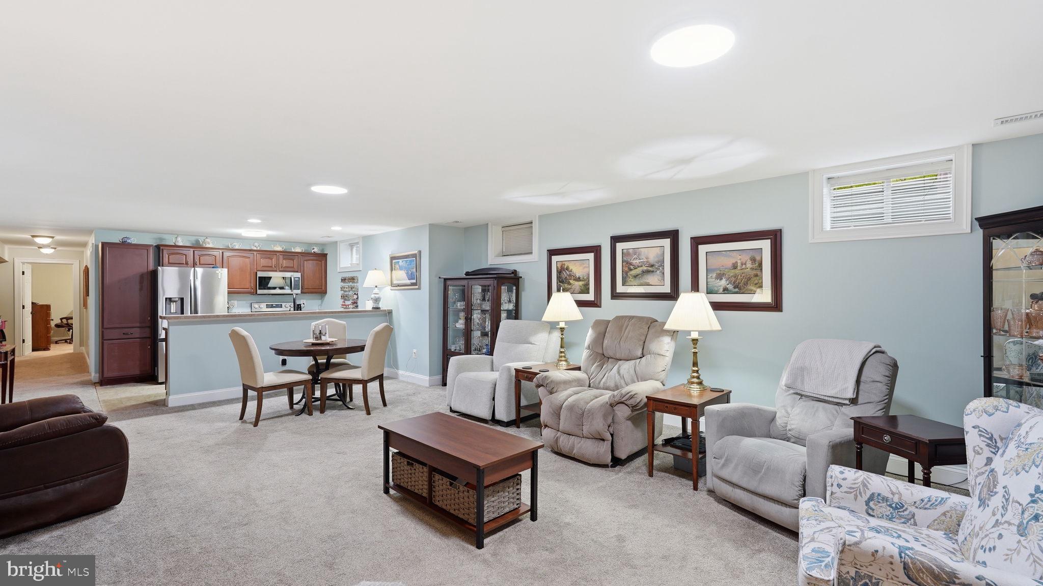 15613 Thoroughfare Road Gainesville, VA 20155 - Photo 43 of 63 a living room with furniture and a wooden floor
