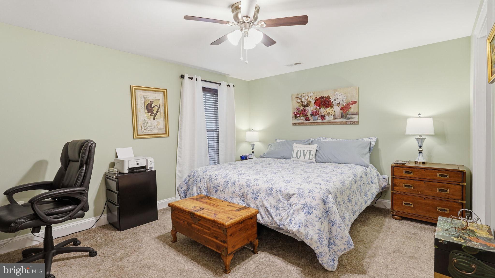 15613 Thoroughfare Road Gainesville, VA 20155 - Photo 46 of 63 a bedroom with a bed and a chair
