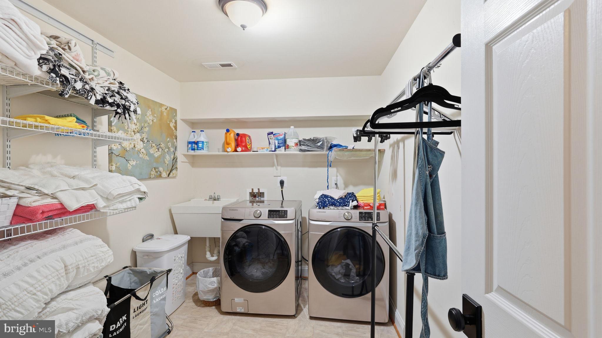 15613 Thoroughfare Road Gainesville, VA 20155 - Photo 52 of 63 a utility room with dryer and washer