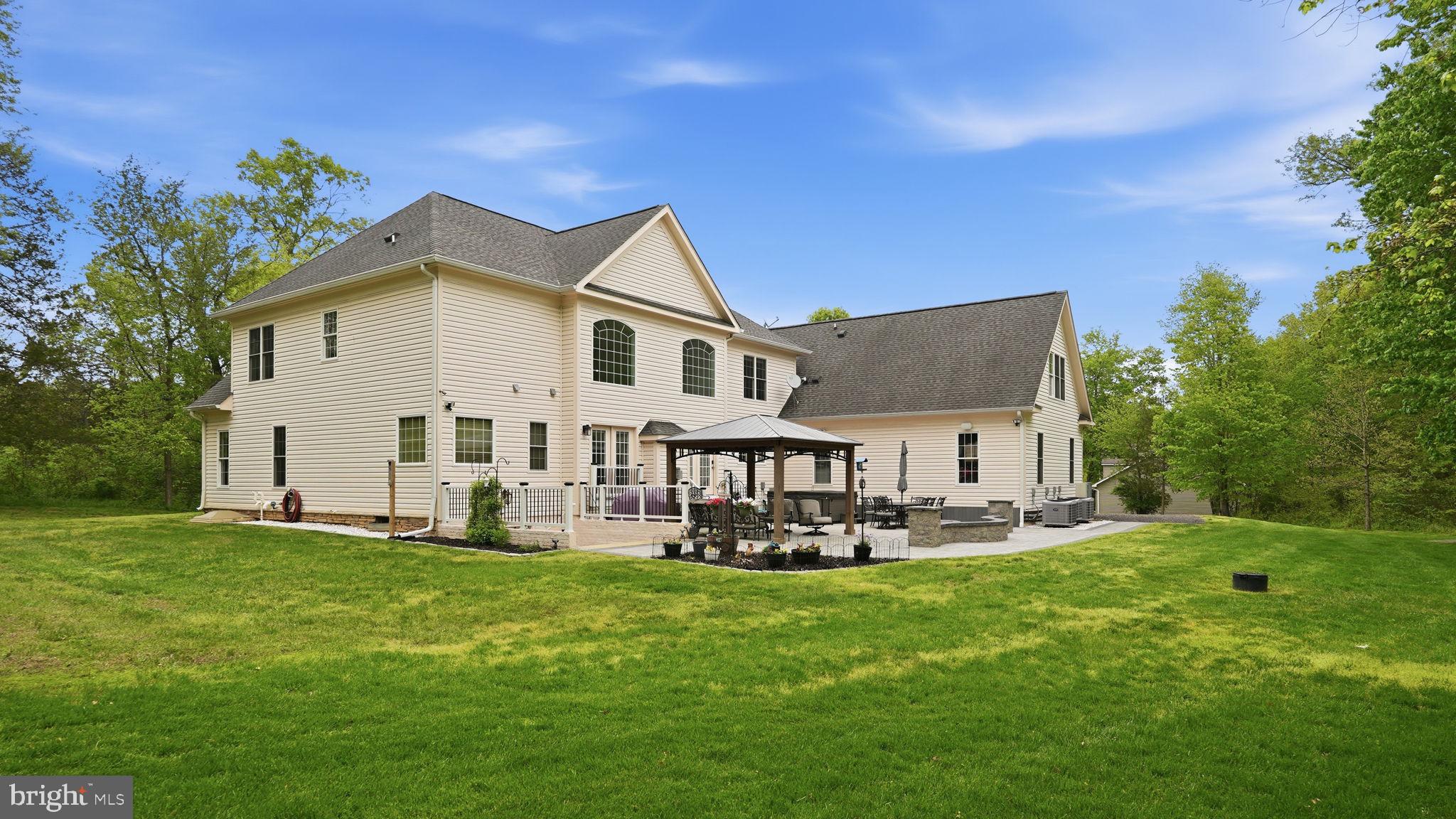 15613 Thoroughfare Road Gainesville, VA 20155 - Photo 53 of 63 a front view of a house with garden