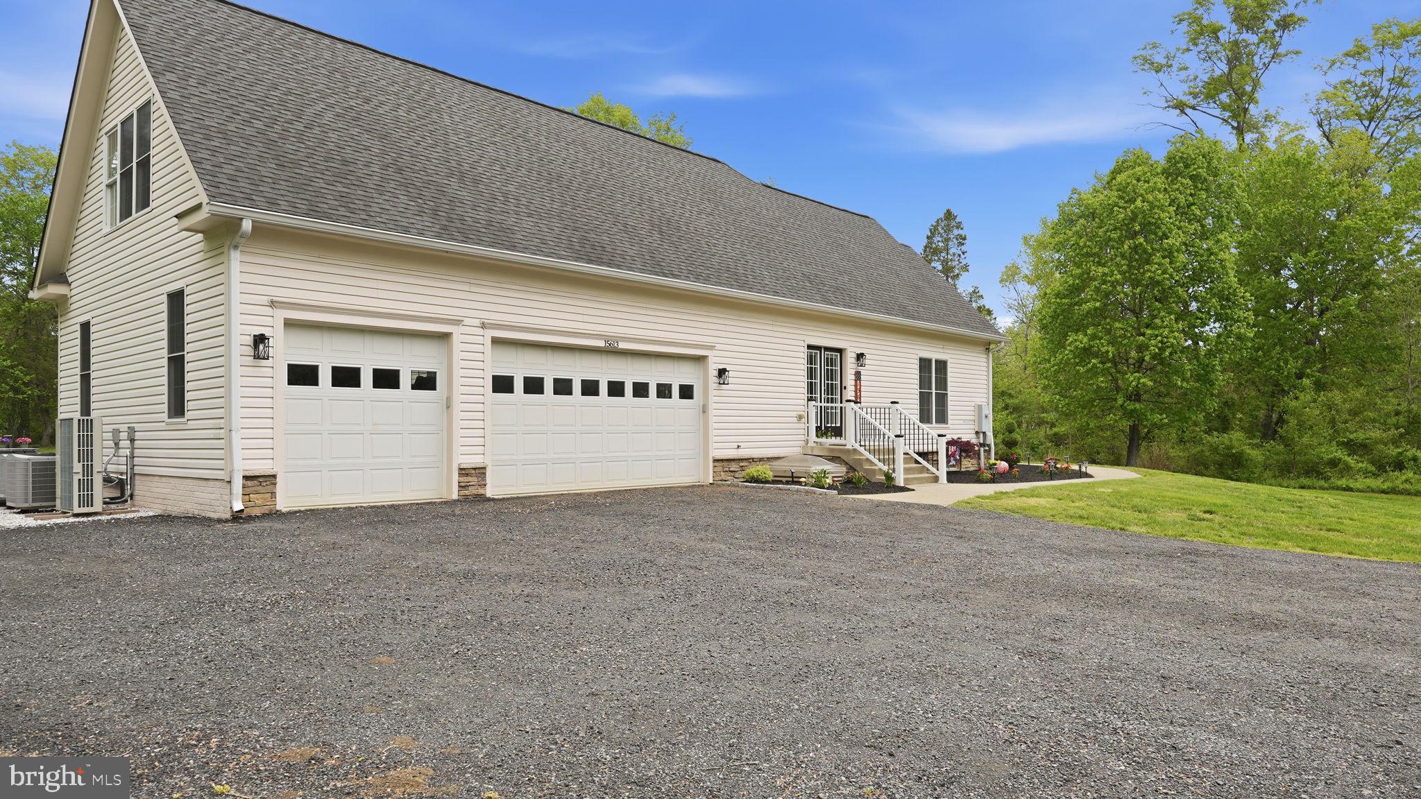 15613 Thoroughfare Road Gainesville, VA 20155 - Photo 58 of 63 a view of a house with backyard and a tree