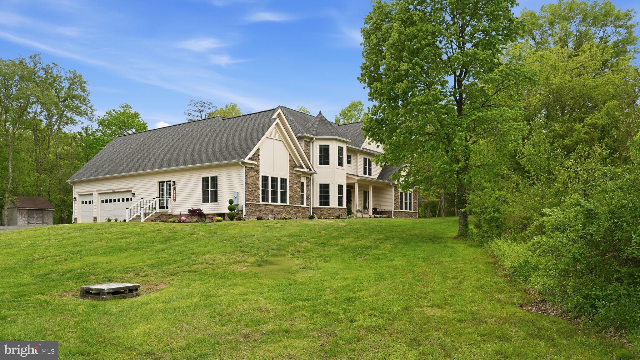 15613 Thoroughfare Road Gainesville, VA 20155 - Photo 6 of 63 a view of a house with a yard