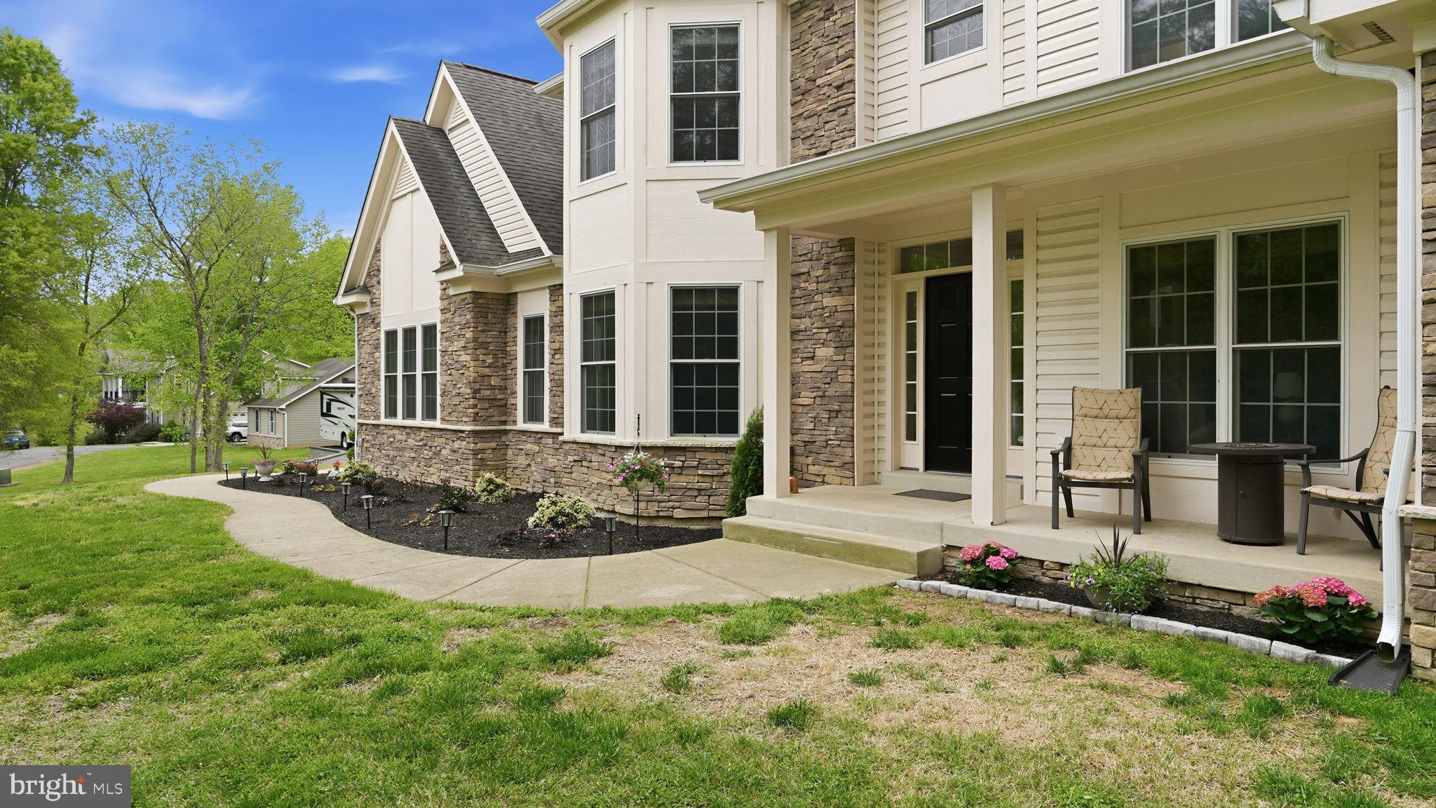 15613 Thoroughfare Road Gainesville, VA 20155 - Photo 7 of 63 front view of a house with a yard