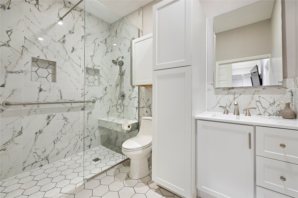7002 Rambollet Terrace Round Rock, TX 78681 - Photo 20 of 37 a bathroom with a sink toilet and shower