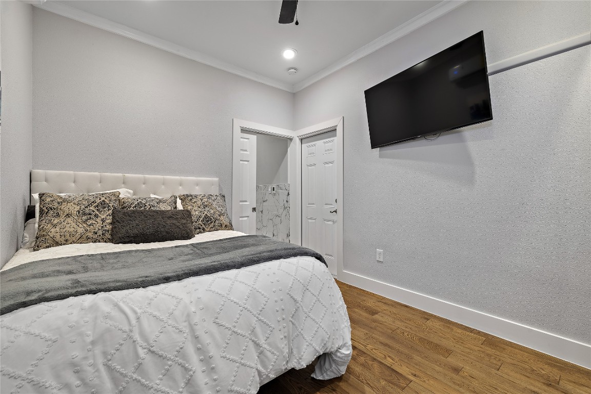 7002 Rambollet Terrace Round Rock, TX 78681 - Photo 21 of 37 a bedroom with a bed and a flat screen tv