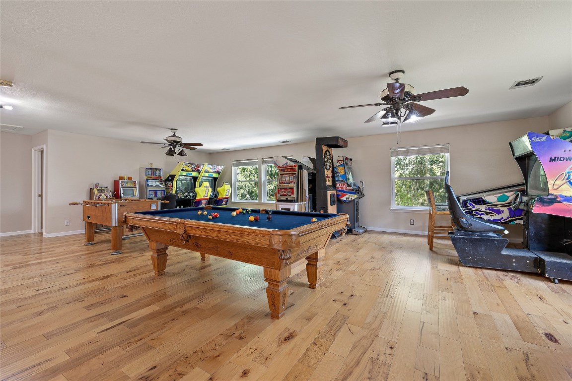 7002 Rambollet Terrace Round Rock, TX 78681 - Photo 24 of 37 a living room with furniture and a wooden floor