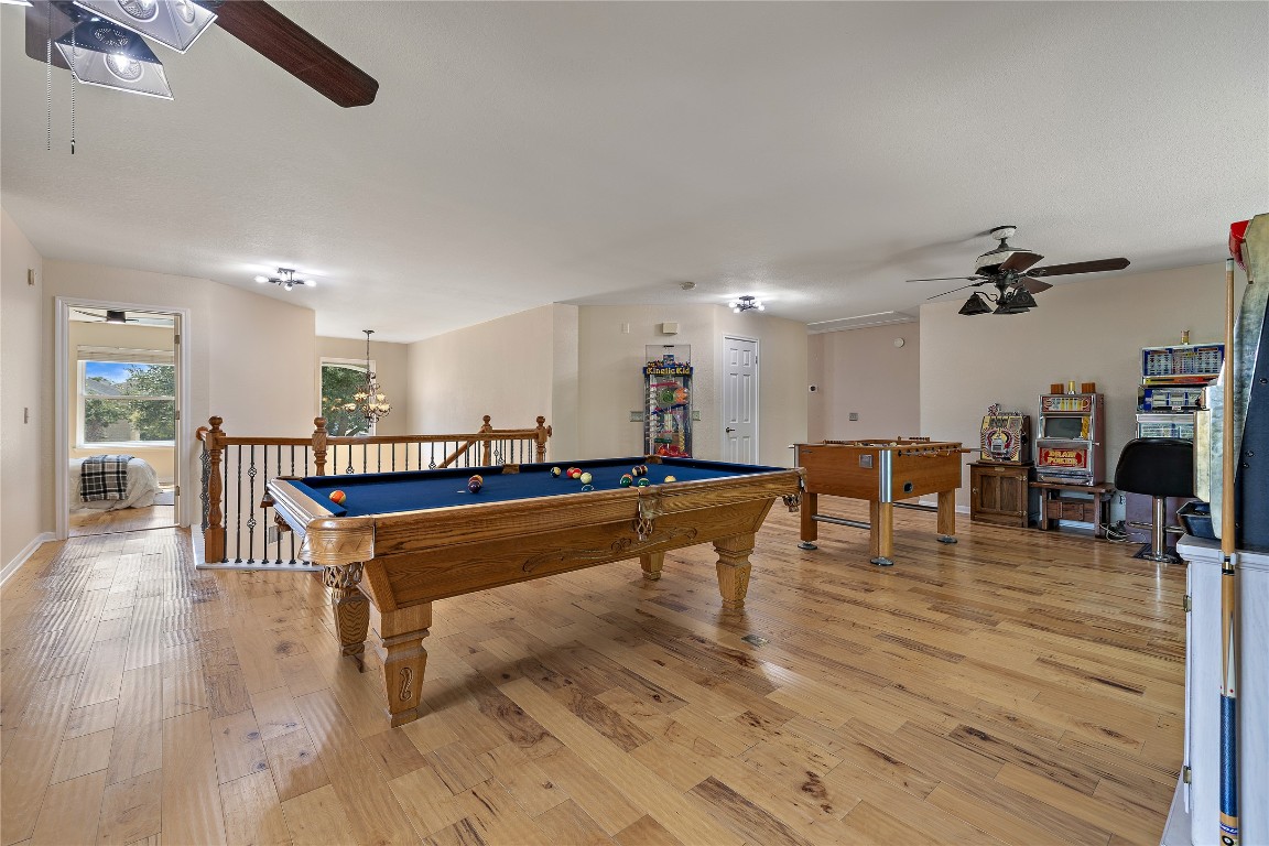 7002 Rambollet Terrace Round Rock, TX 78681 - Photo 25 of 37 a living room with furniture a table and kitchen view