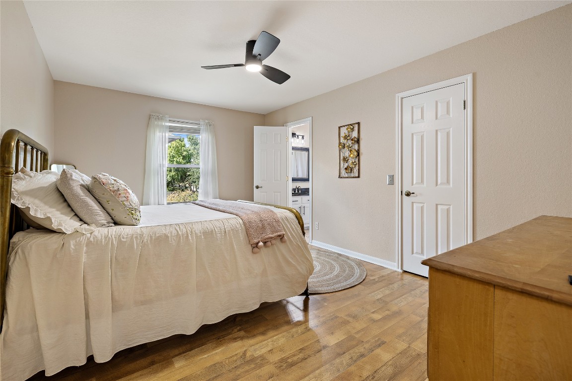 7002 Rambollet Terrace Round Rock, TX 78681 - Photo 28 of 37 a spacious bedroom with a bed and a dresser