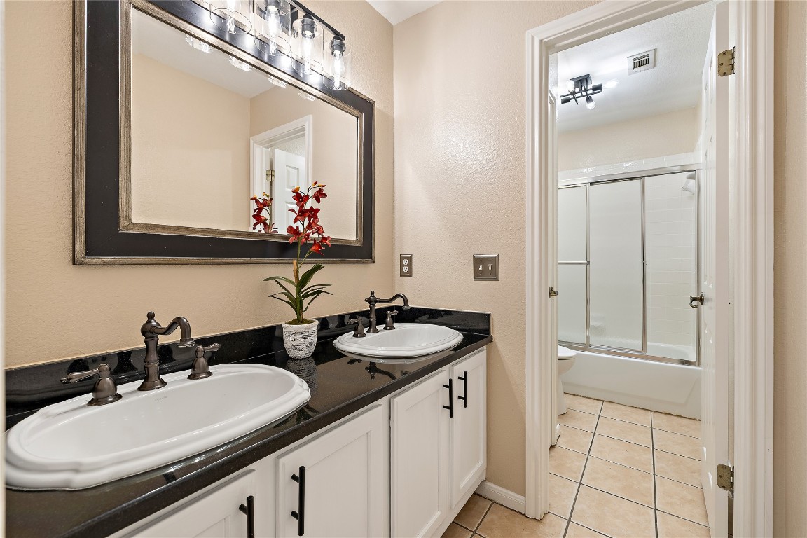 7002 Rambollet Terrace Round Rock, TX 78681 - Photo 32 of 37 a bathroom with a sink and a mirror