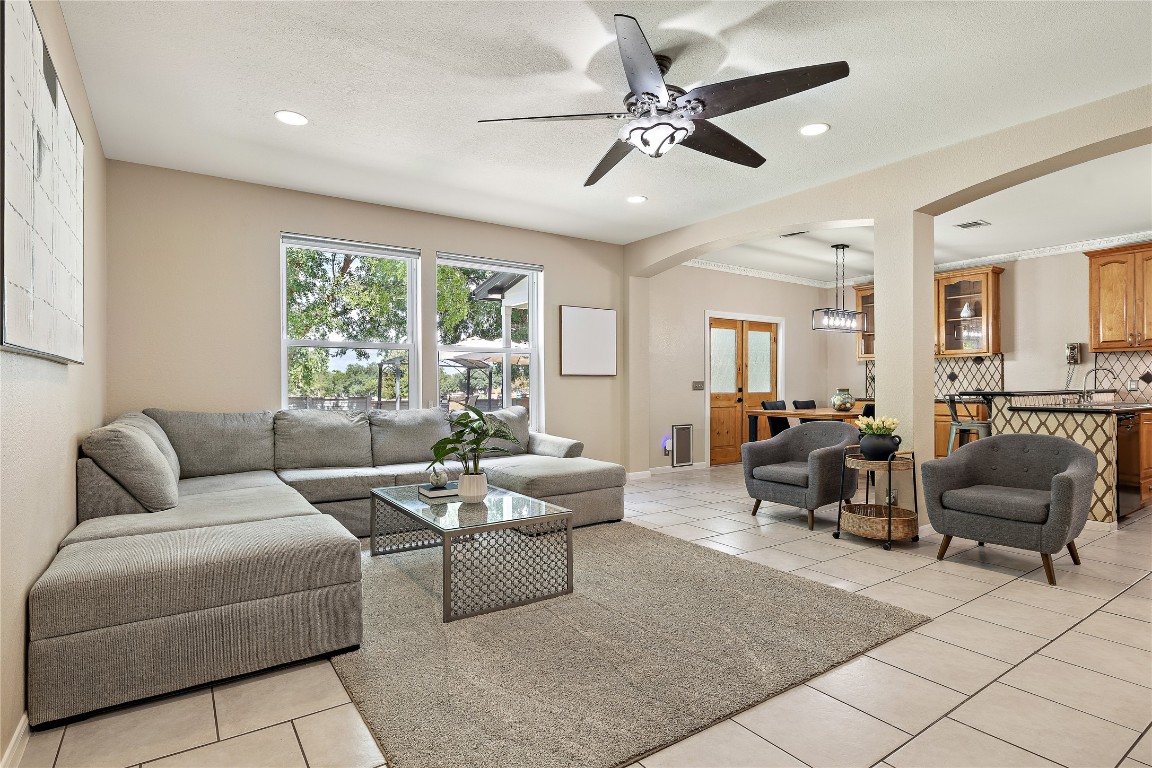 7002 Rambollet Terrace Round Rock, TX 78681 - Photo 7 of 37 a living room with furniture and a large window