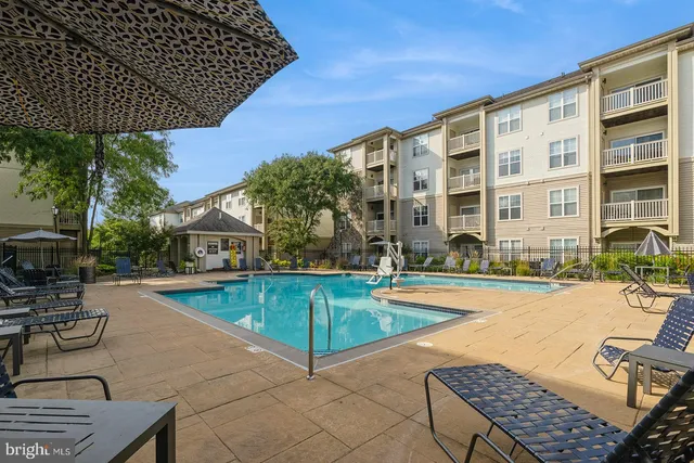 a view of a swimming pool with lounge chairs