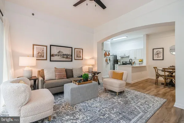 a living room with furniture and a rug