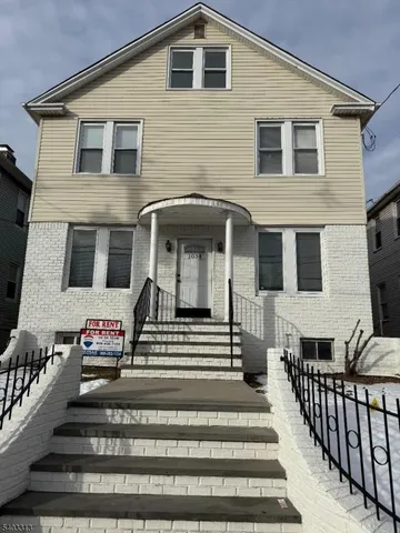 a front view of a house with a balcony