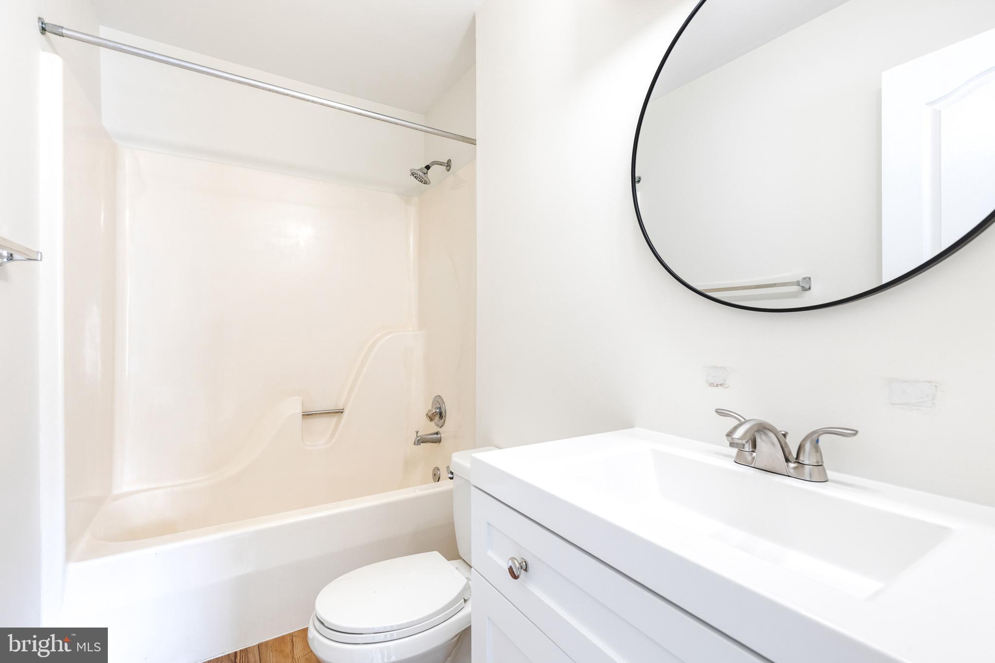 611 Brickston Road Reisterstown, MD 21136 - Photo 13 of 16 a bathroom with a sink toilet and shower