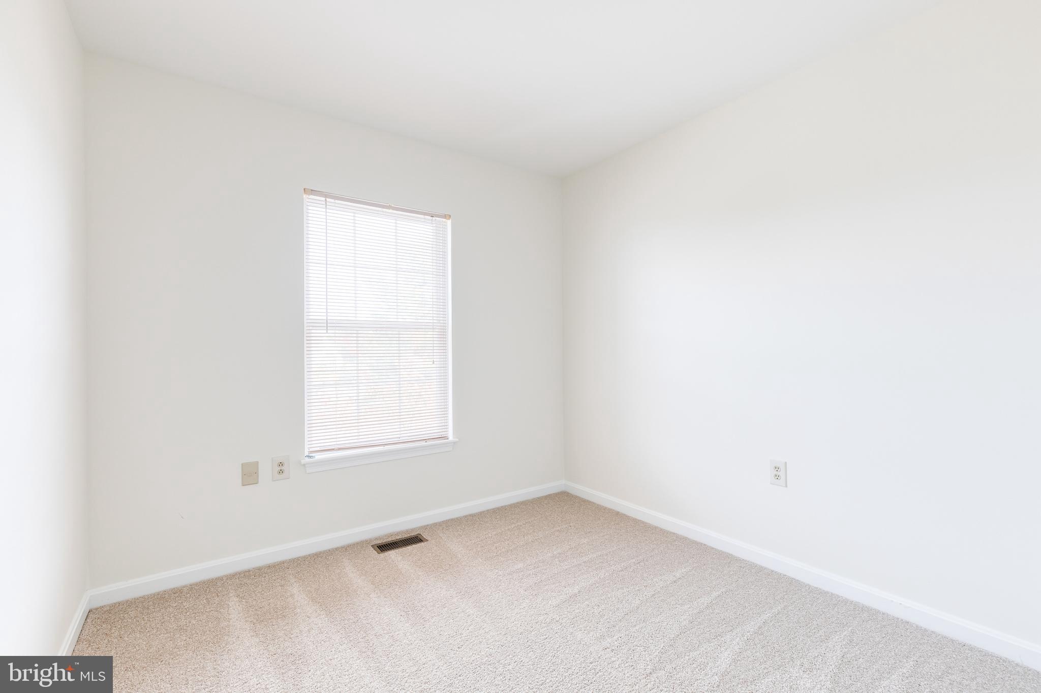 611 Brickston Road Reisterstown, MD 21136 - Photo 15 of 16 an empty room with a window