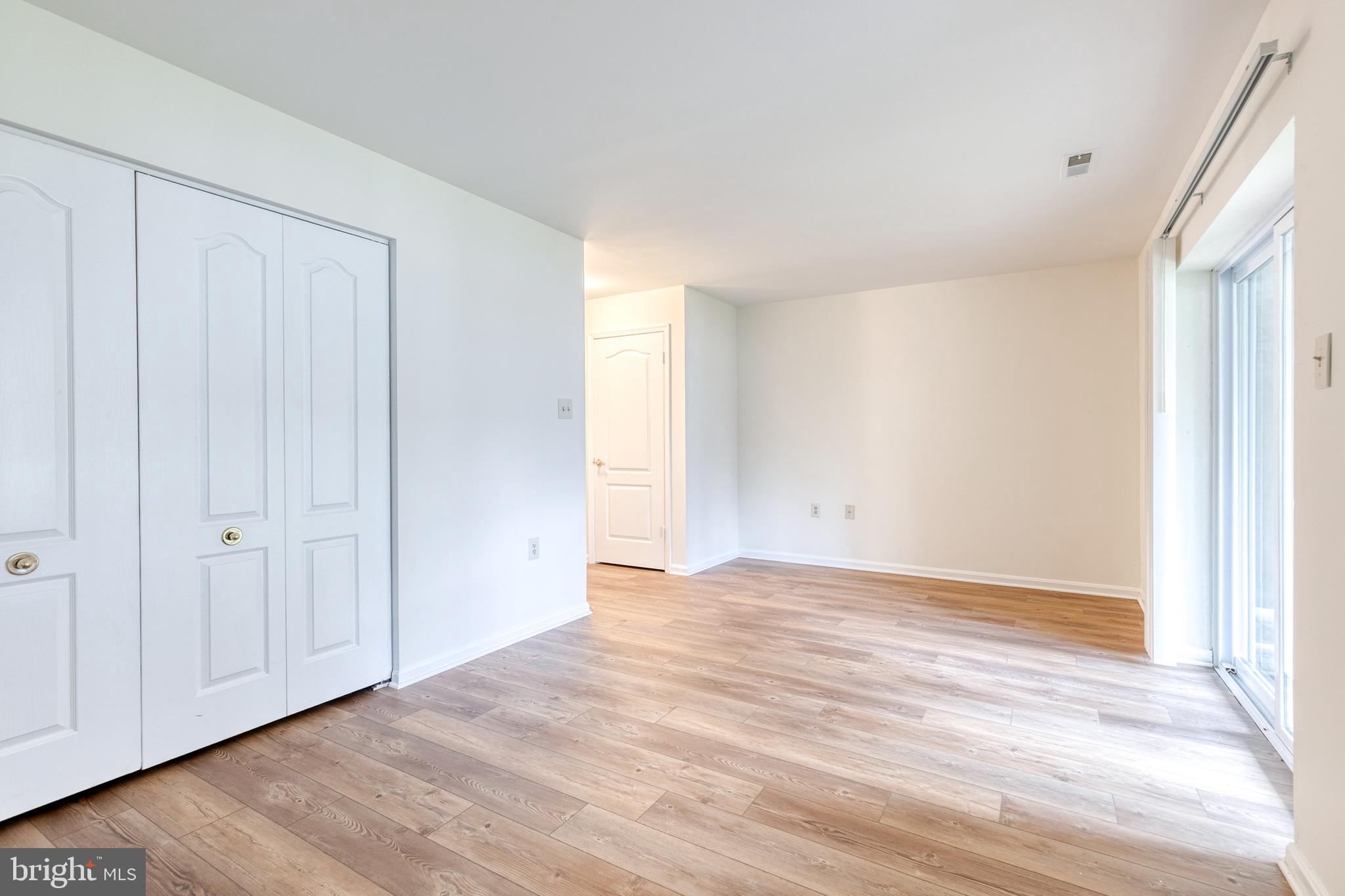 611 Brickston Road Reisterstown, MD 21136 - Photo 3 of 16 a view of an empty room with wooden floor