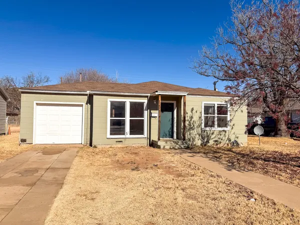 a front view of a house with a outdoor space