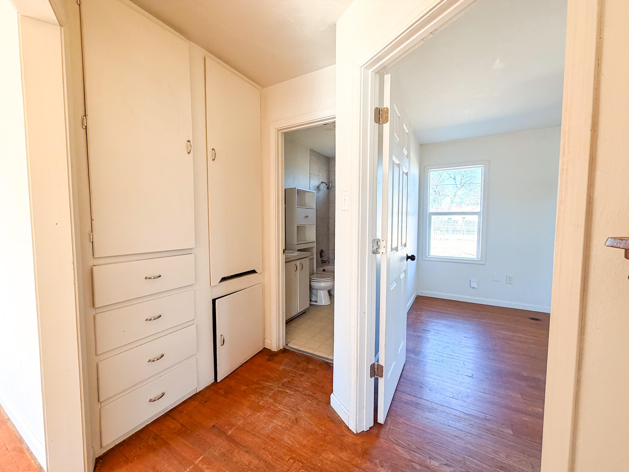 2616 38th Street Lubbock, TX 79413 - Photo 3 of 12 a view of a hallway with wooden floor