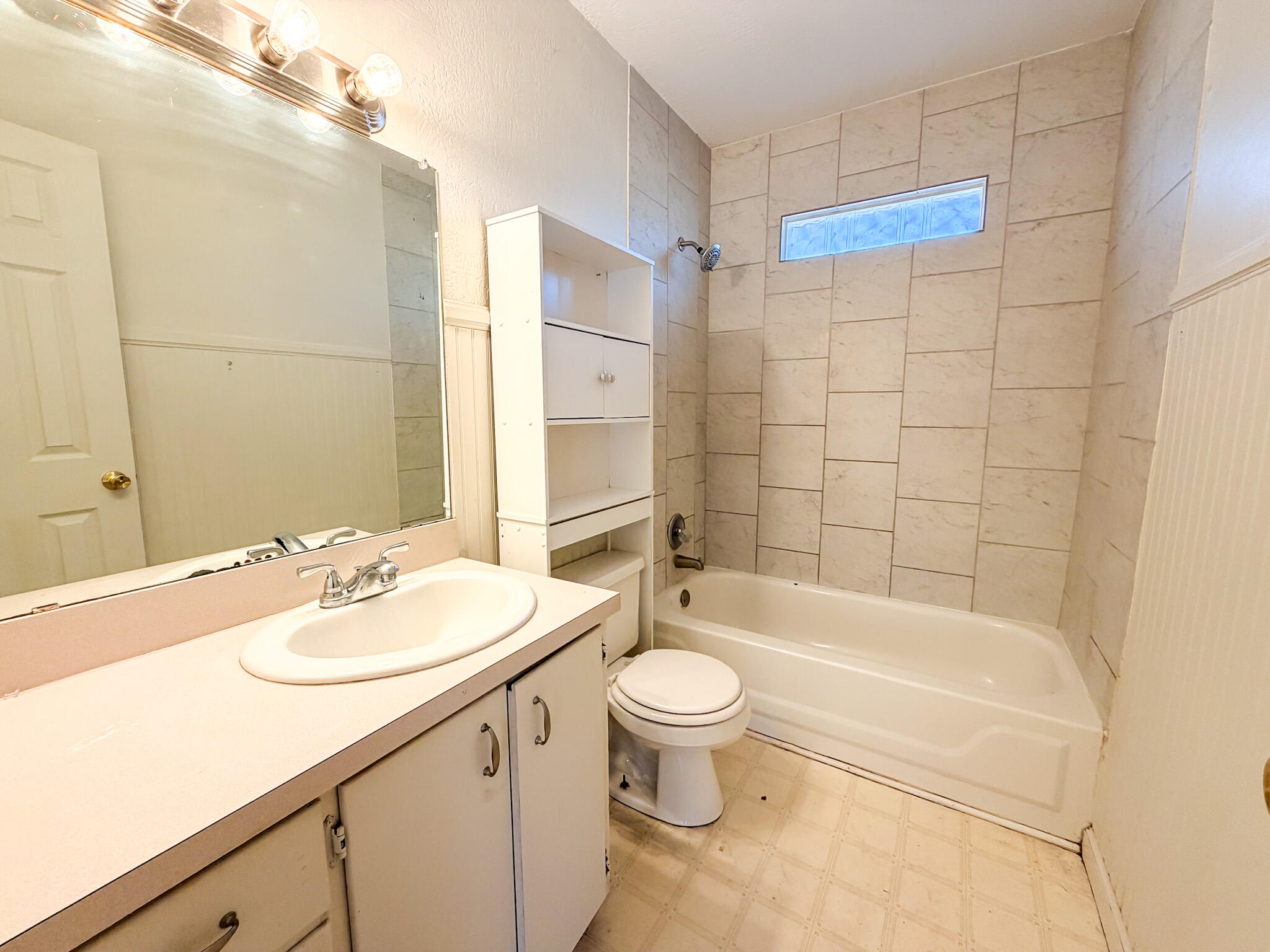 2616 38th Street Lubbock, TX 79413 - Photo 8 of 12 a bathroom with a sink a toilet and shower