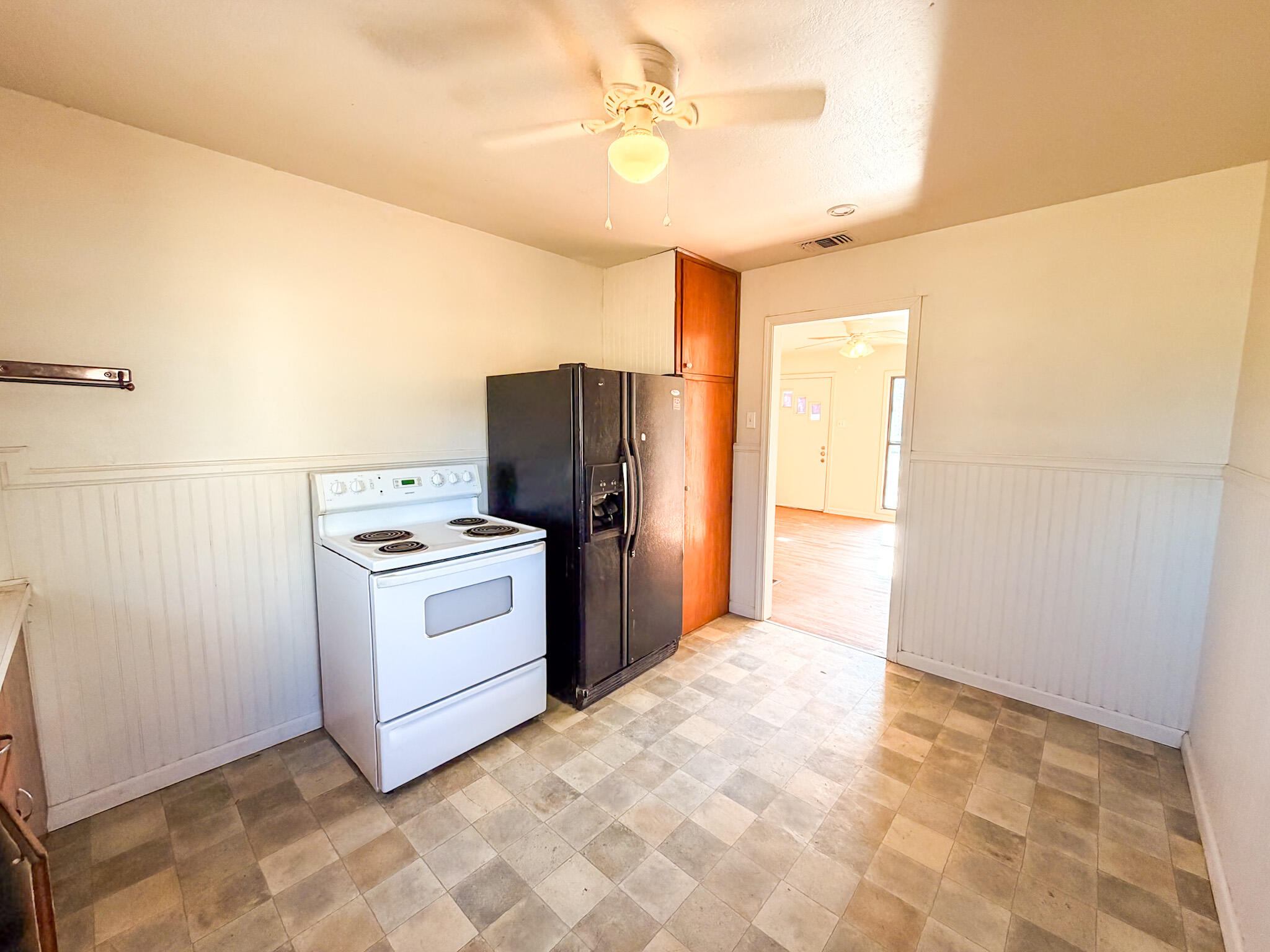 2616 38th Street Lubbock, TX 79413 - Photo 10 of 12 a kitchen with stainless steel appliances a refrigerator sink and stove