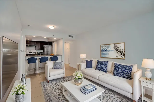 a bathroom with a sink toilet vanity and shower