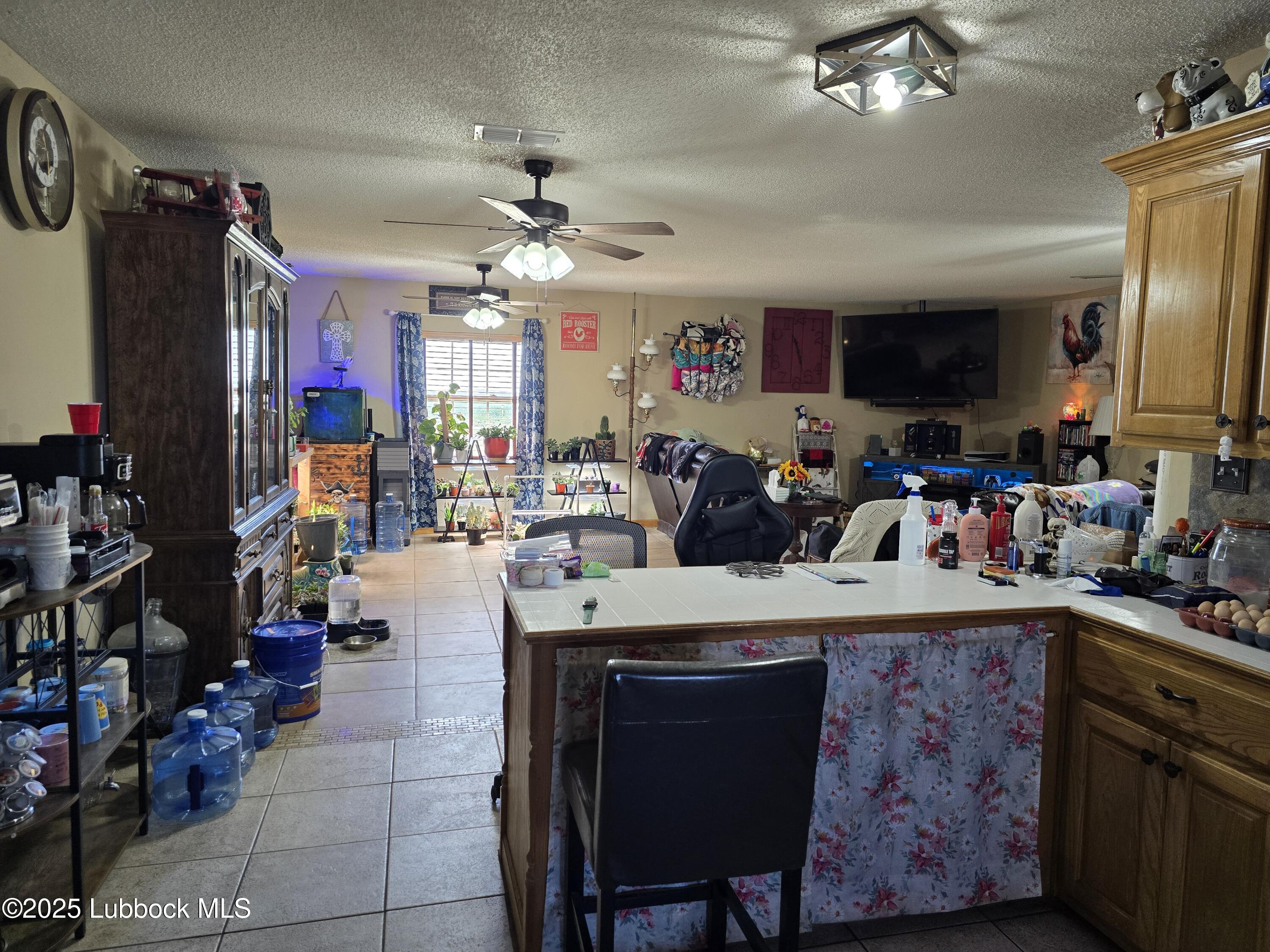 390 County Road Kress, TX 79052 - Photo 13 of 58 a view of a dining room with furniture and a window