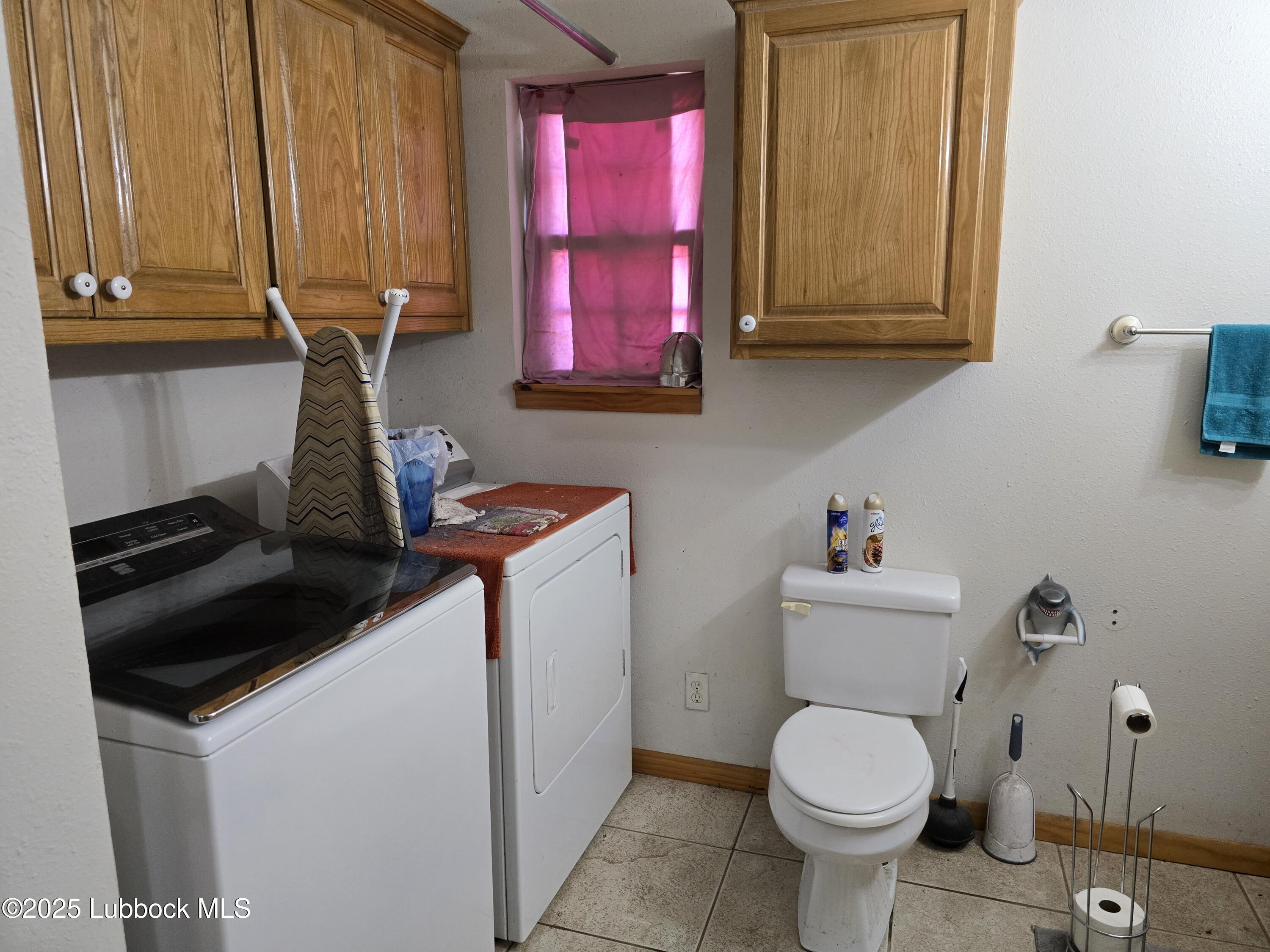 390 County Road Kress, TX 79052 - Photo 15 of 58 a bathroom with a toilet sink and mirror