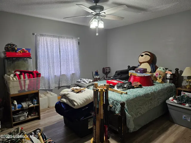 a bedroom with a bed and flat screen tv