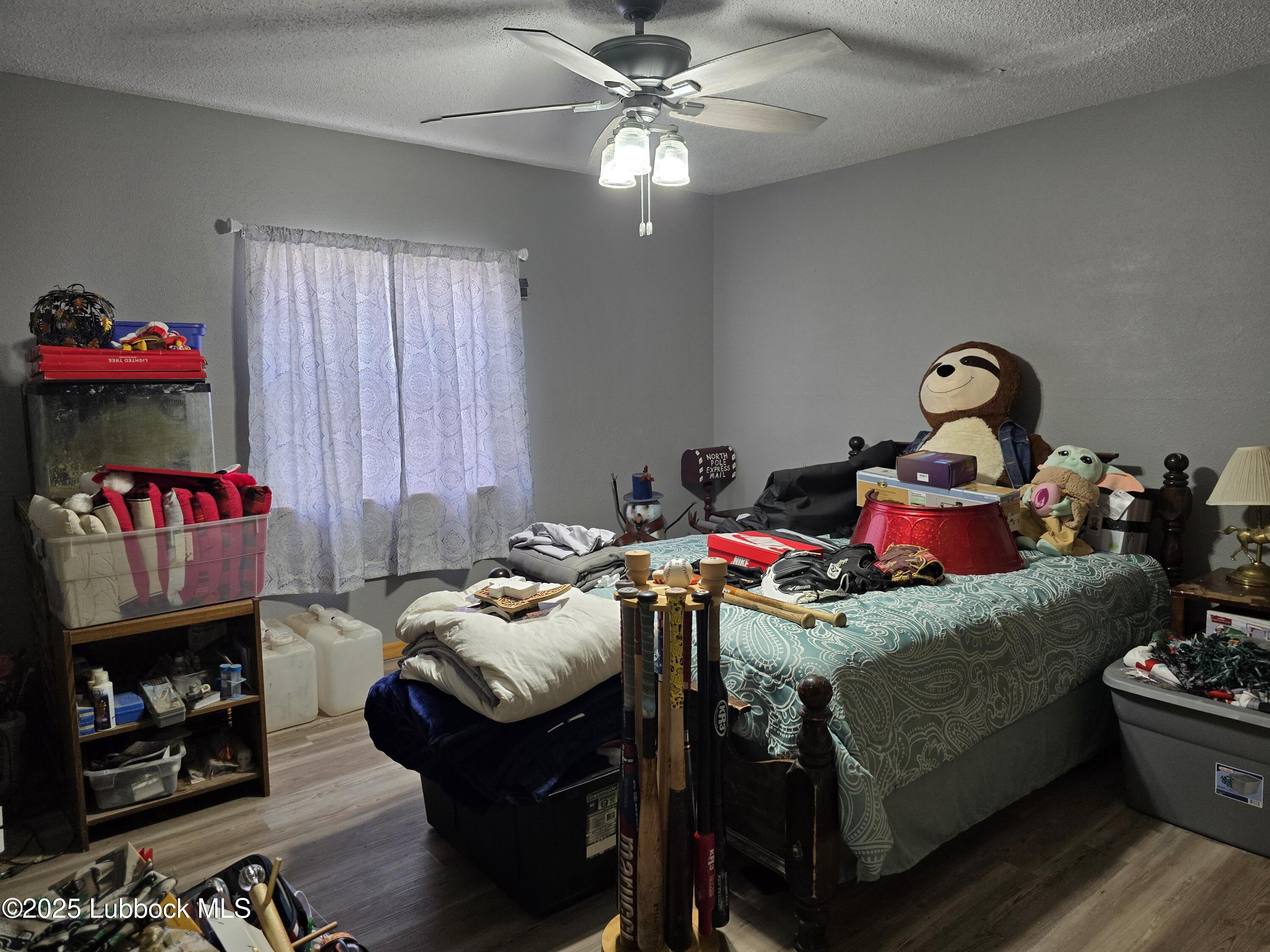 390 County Road Kress, TX 79052 - Photo 19 of 58 a living room with furniture and a fireplace
