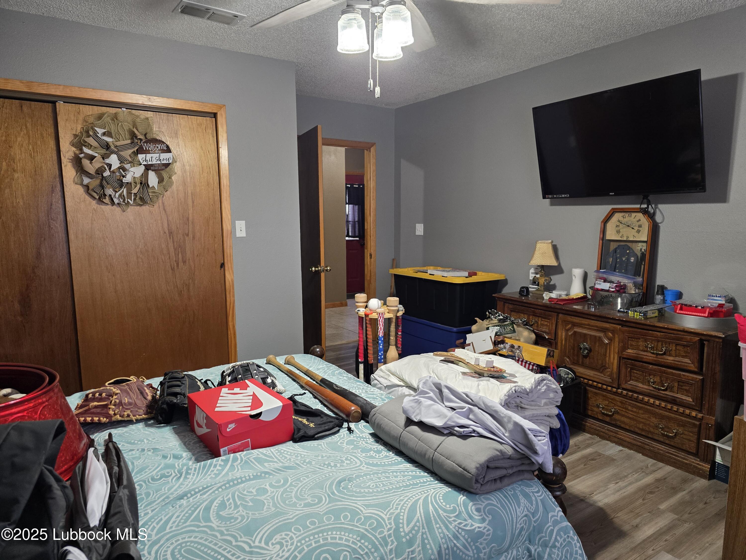 390 County Road Kress, TX 79052 - Photo 20 of 58 a bedroom with a bed and flat screen tv