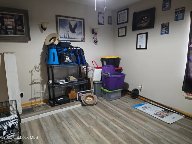 a room with wooden floor and furniture