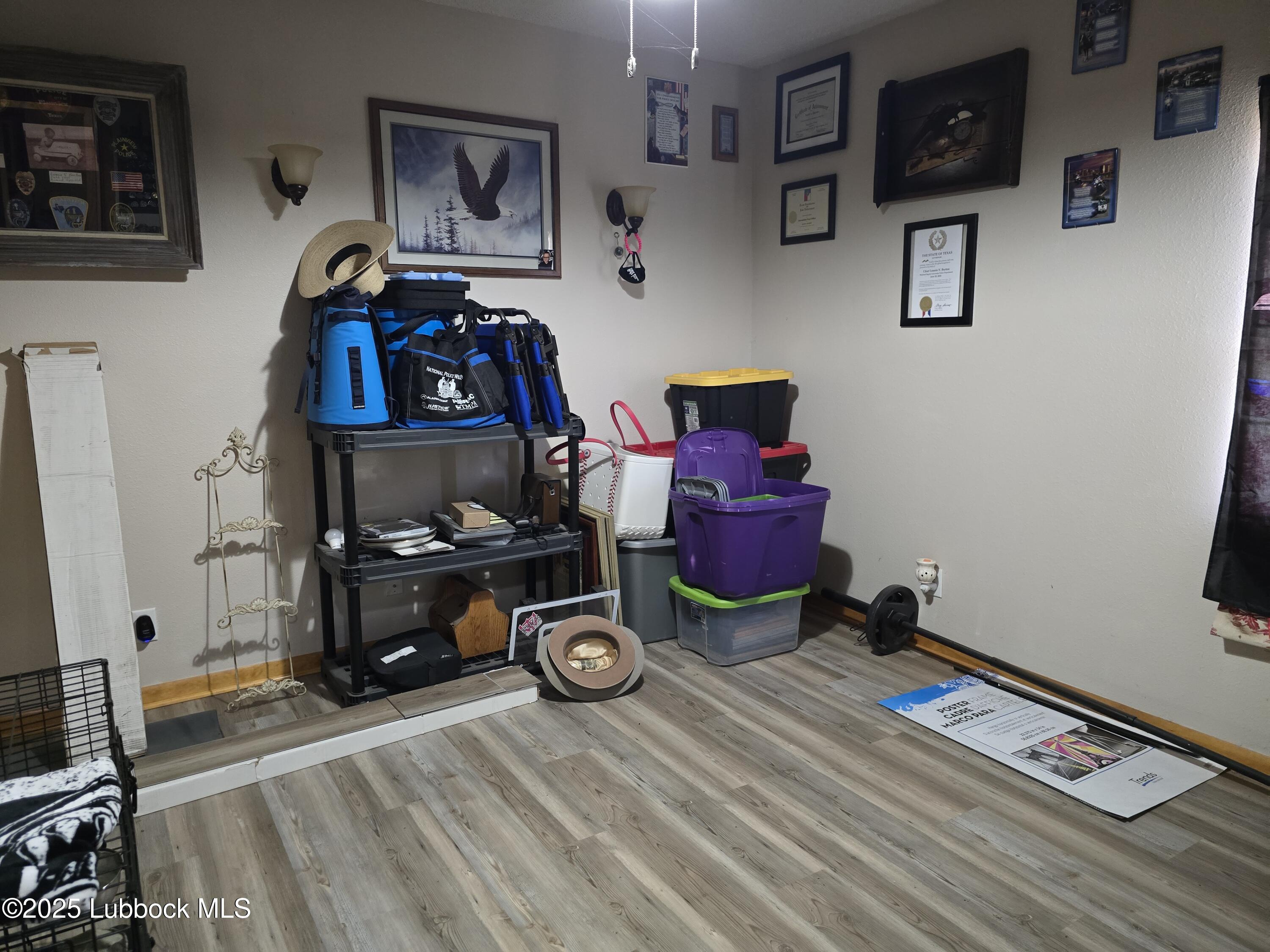 390 County Road Kress, TX 79052 - Photo 21 of 58 a room with furniture and wooden floor