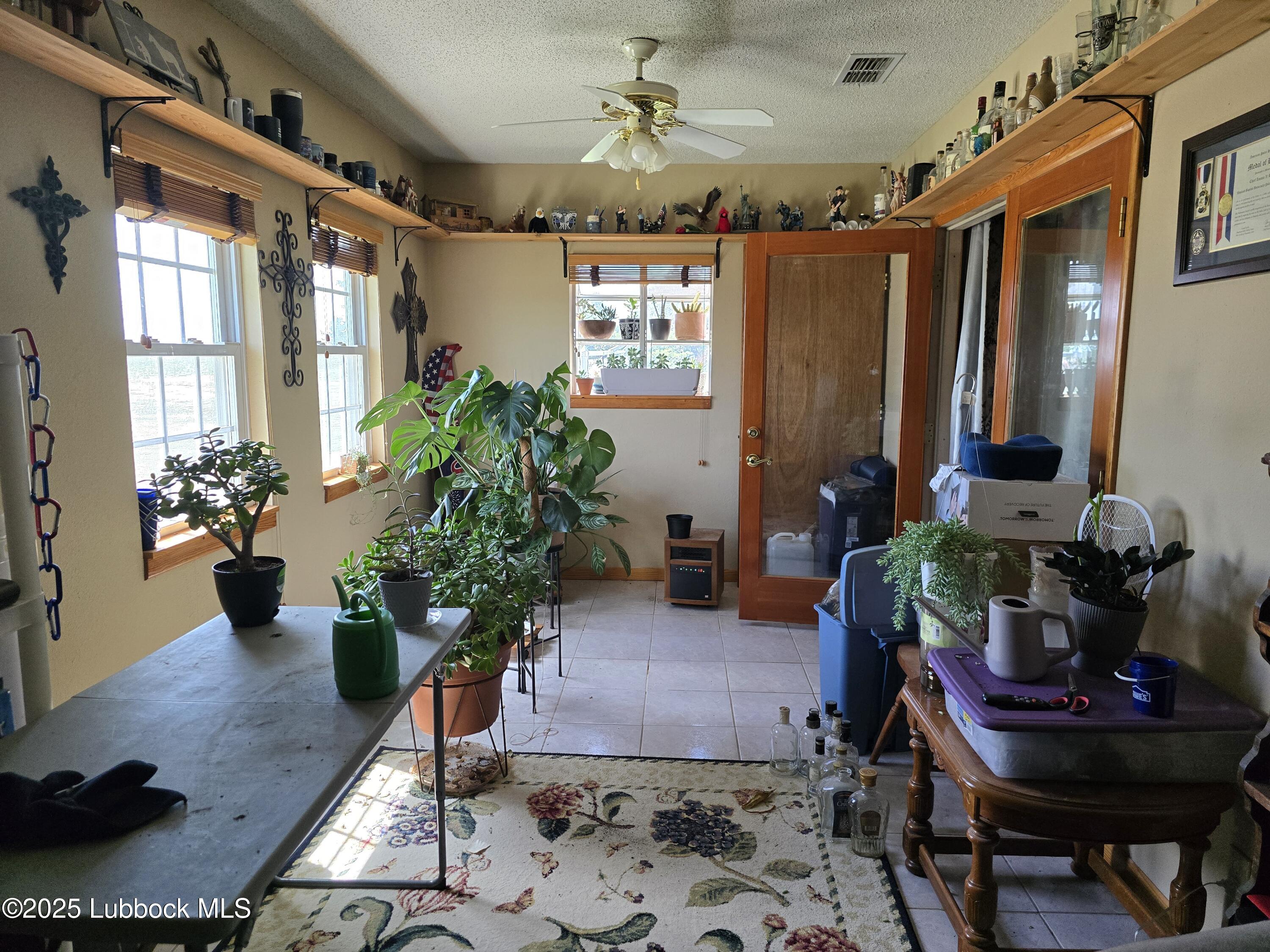 390 County Road Kress, TX 79052 - Photo 24 of 58 a living room with furniture and a potted plant