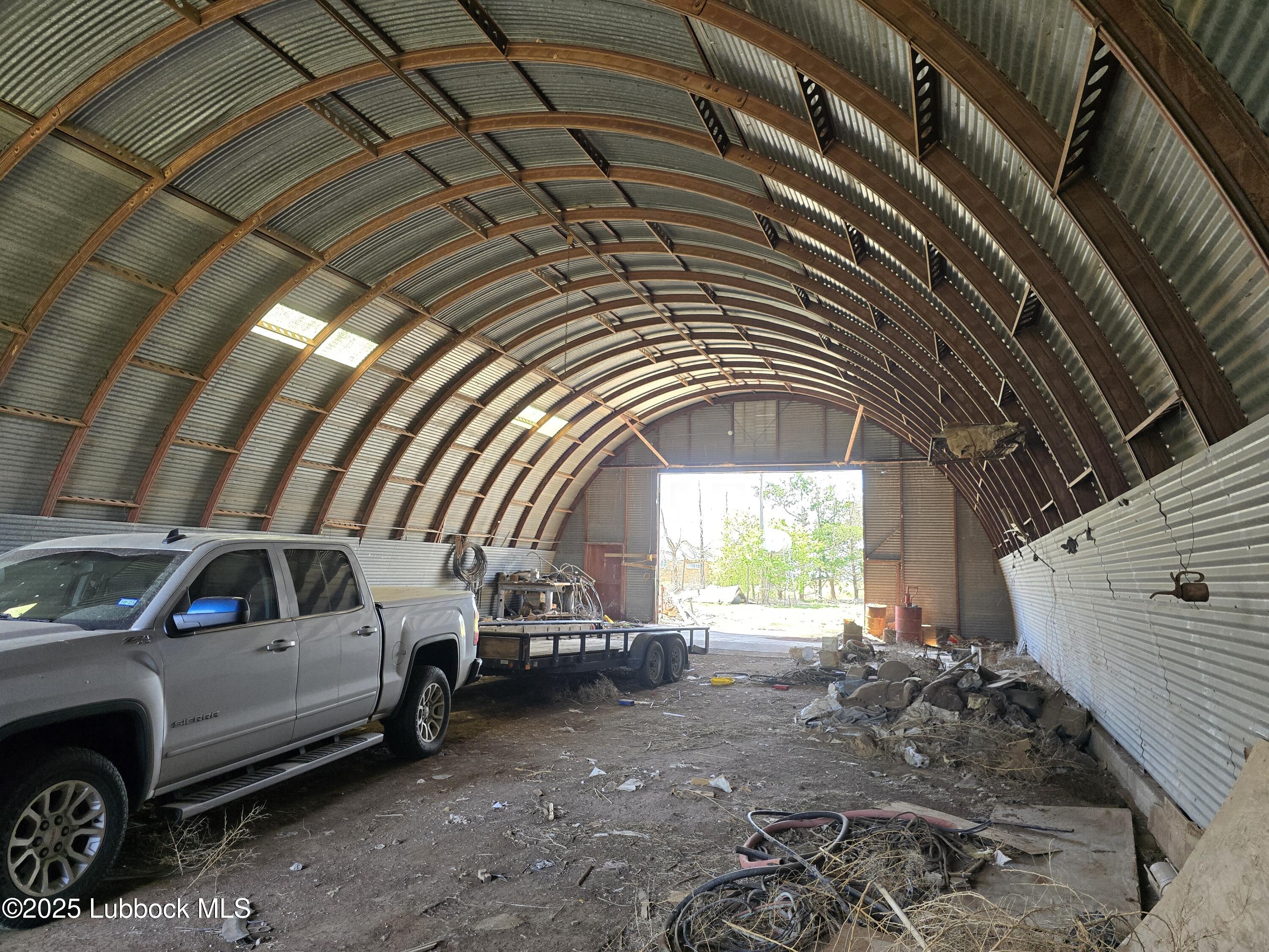 390 County Road Kress, TX 79052 - Photo 40 of 58 a view of a car parking garage