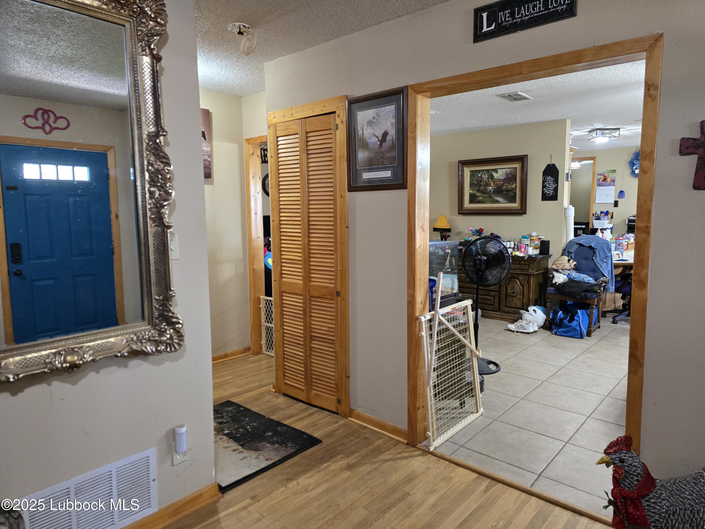 390 County Road Kress, TX 79052 - Photo 4 of 58 a view of walk in closet with clothes and shoes