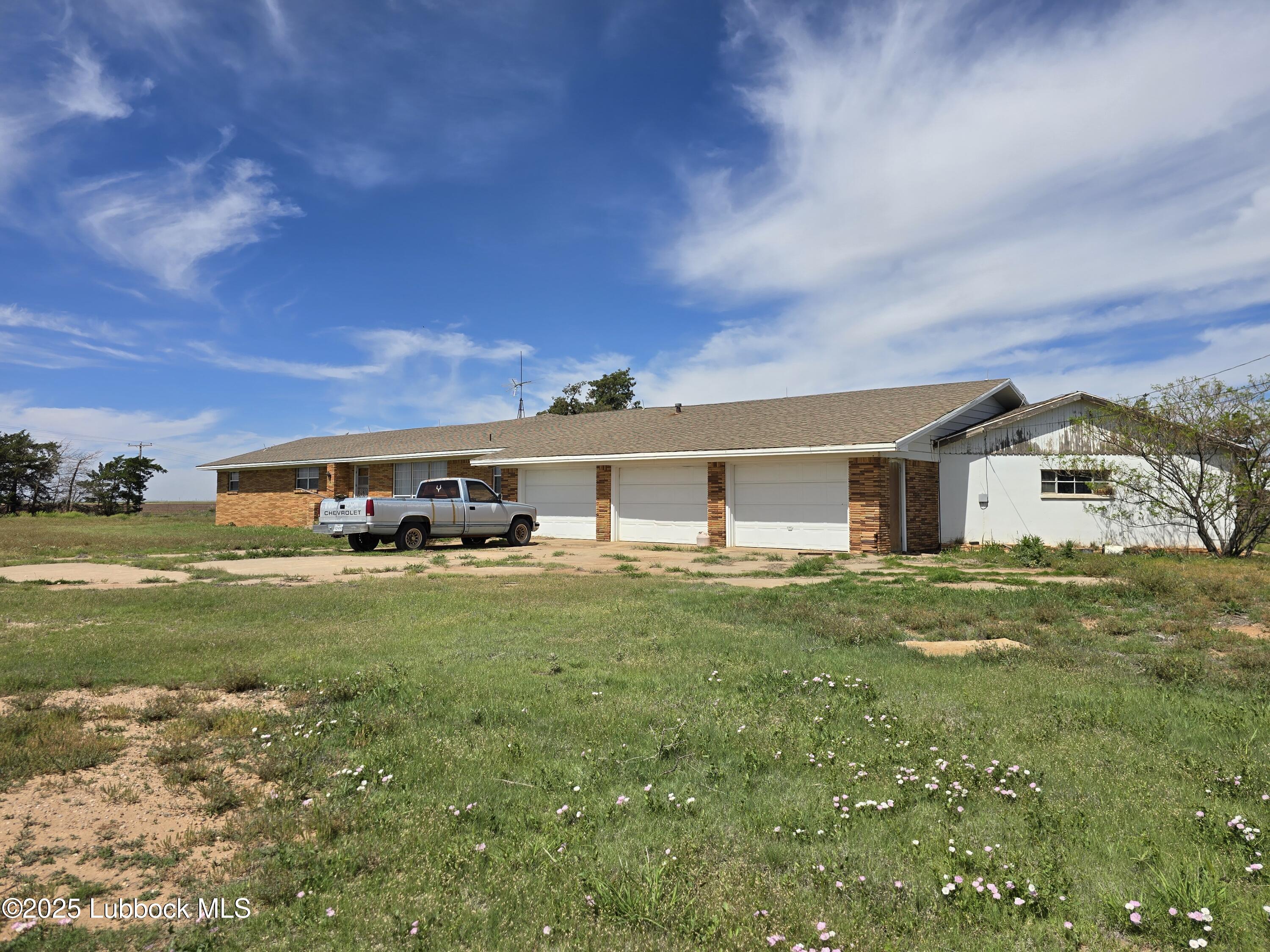 390 County Road Kress, TX 79052 - Photo 44 of 58 a front view of house with yard and green space