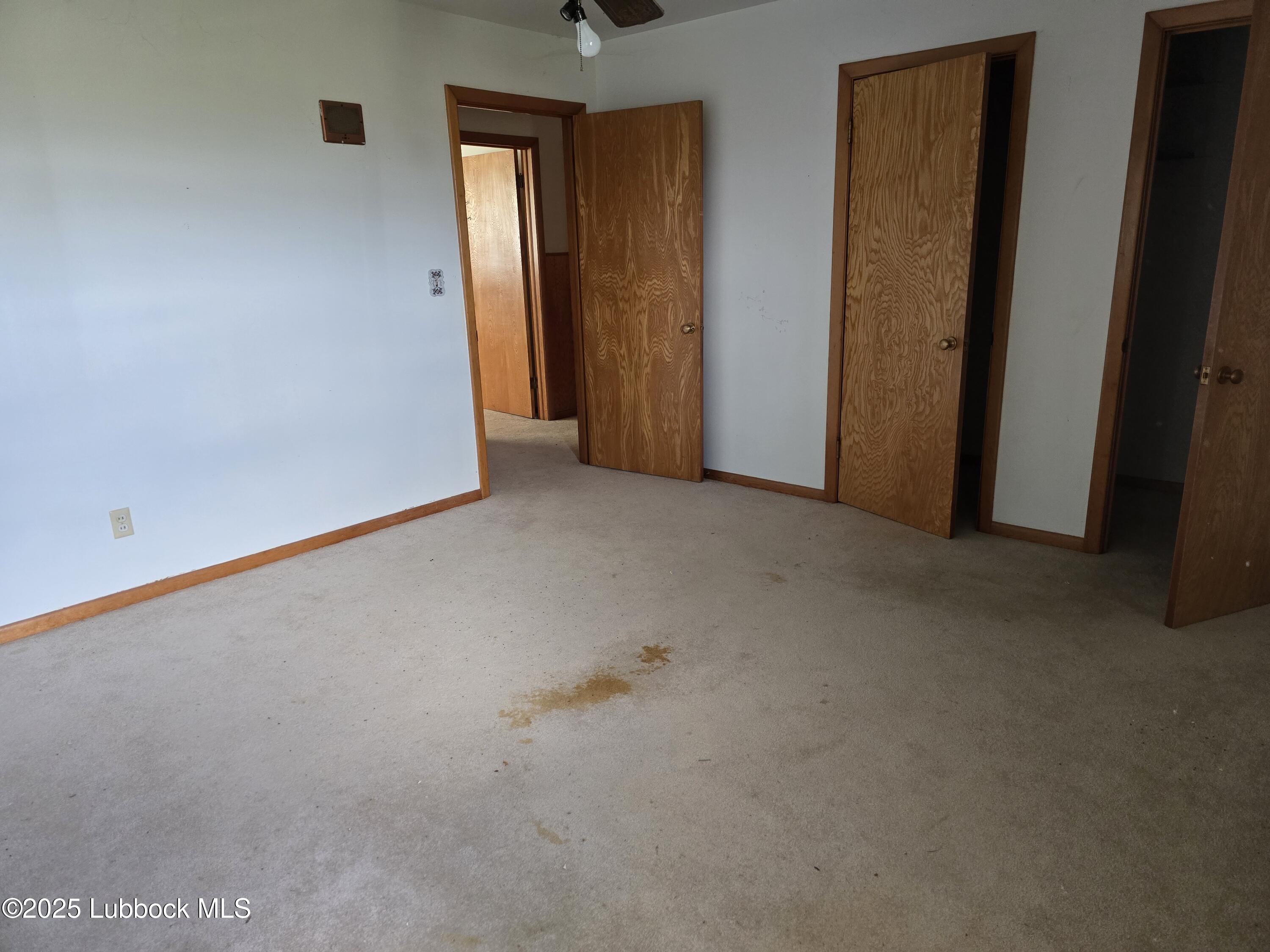 390 County Road Kress, TX 79052 - Photo 56 of 58 an empty room that has a mirror