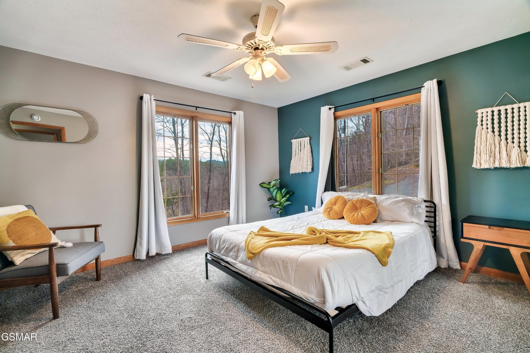 4062 Wilhite Road Sevierville, TN 37876 - Photo 32 of 50 a bedroom with a bed a chandelier and a window