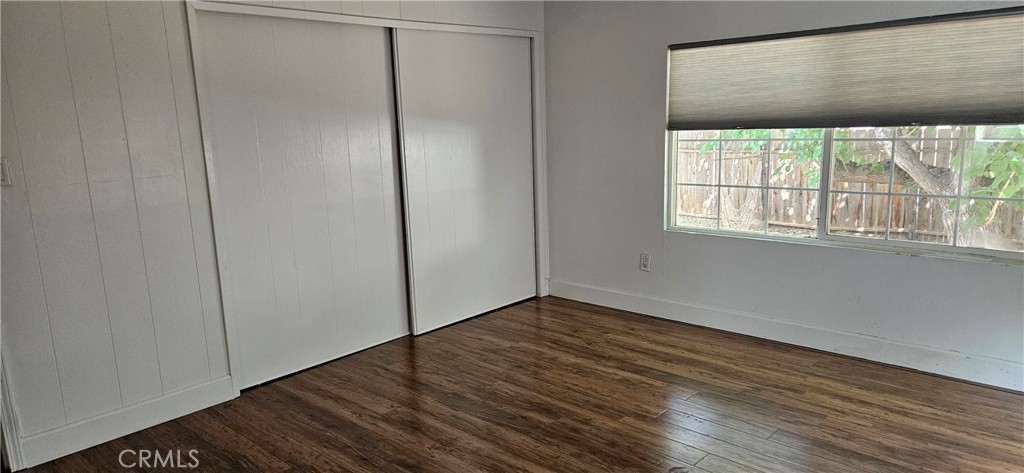 2920 Clark Road, Unit C12 Oroville, CA 95965 - Photo 8 of 17 a view of an empty room with wooden floor and a window