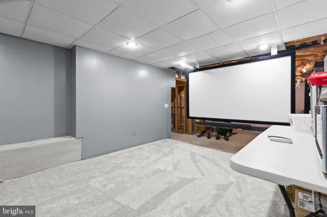 a room with furniture and screen