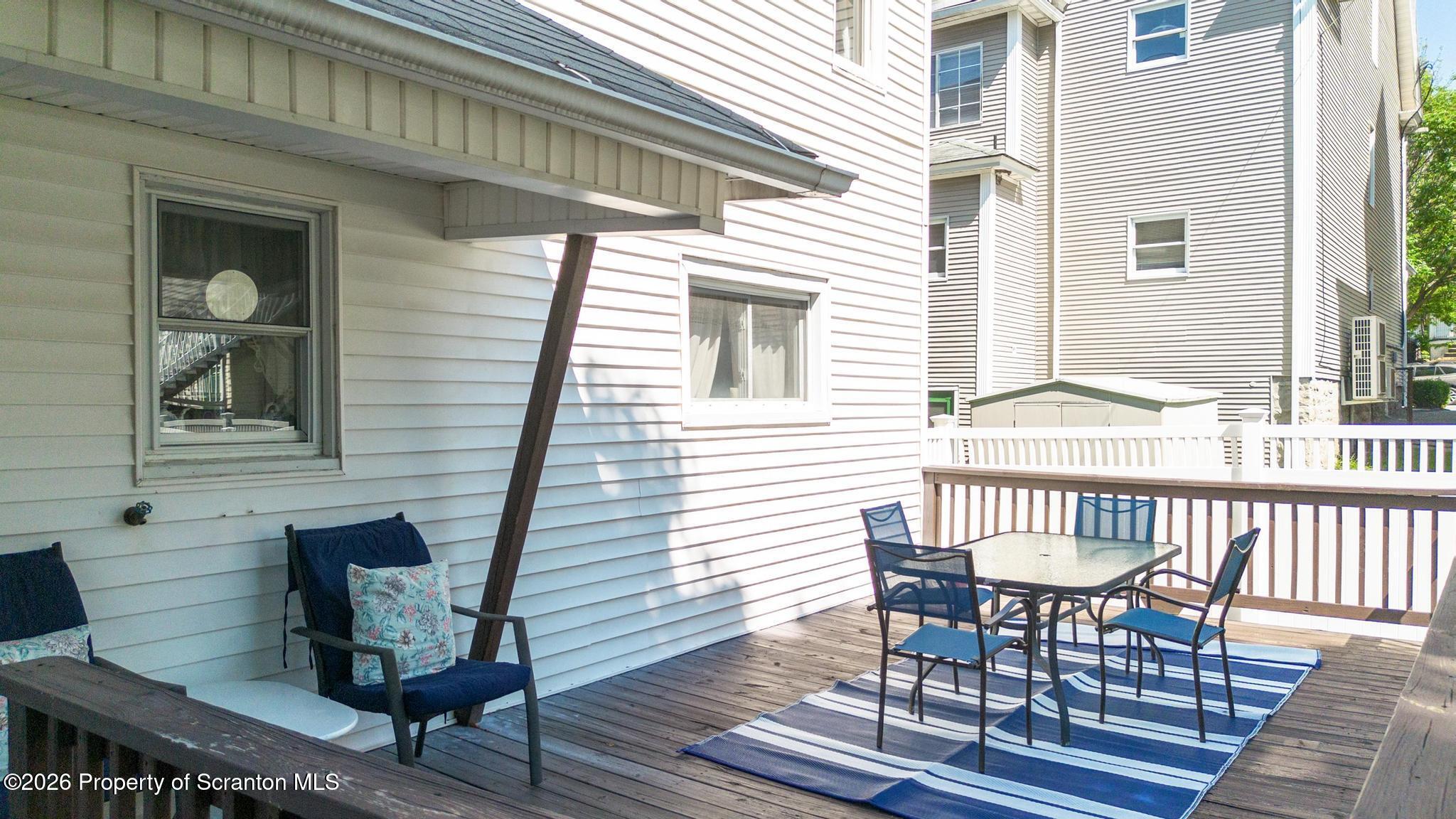 616 Myrtle Street Scranton, PA 18510 - Photo 54 of 65 a view of a patio with a table and chairs