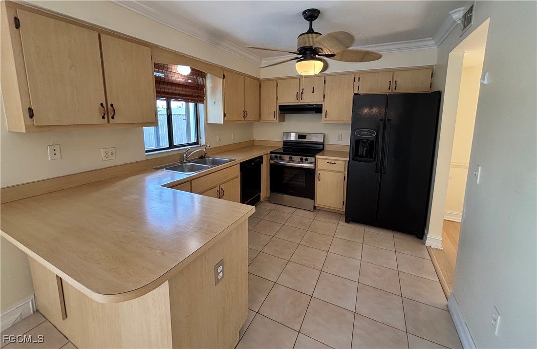 7280 Pebble Beach Road Fort Myers, FL 33967 - Photo 5 of 15 a kitchen with a sink a stove cabinets and a refrigerator