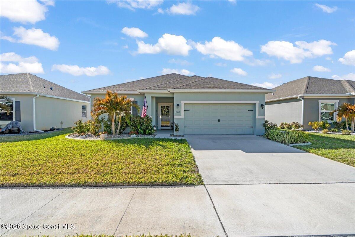 881 Covington Court Rockledge, FL 32955 - Photo 1 of 30 a front view of a house with garden