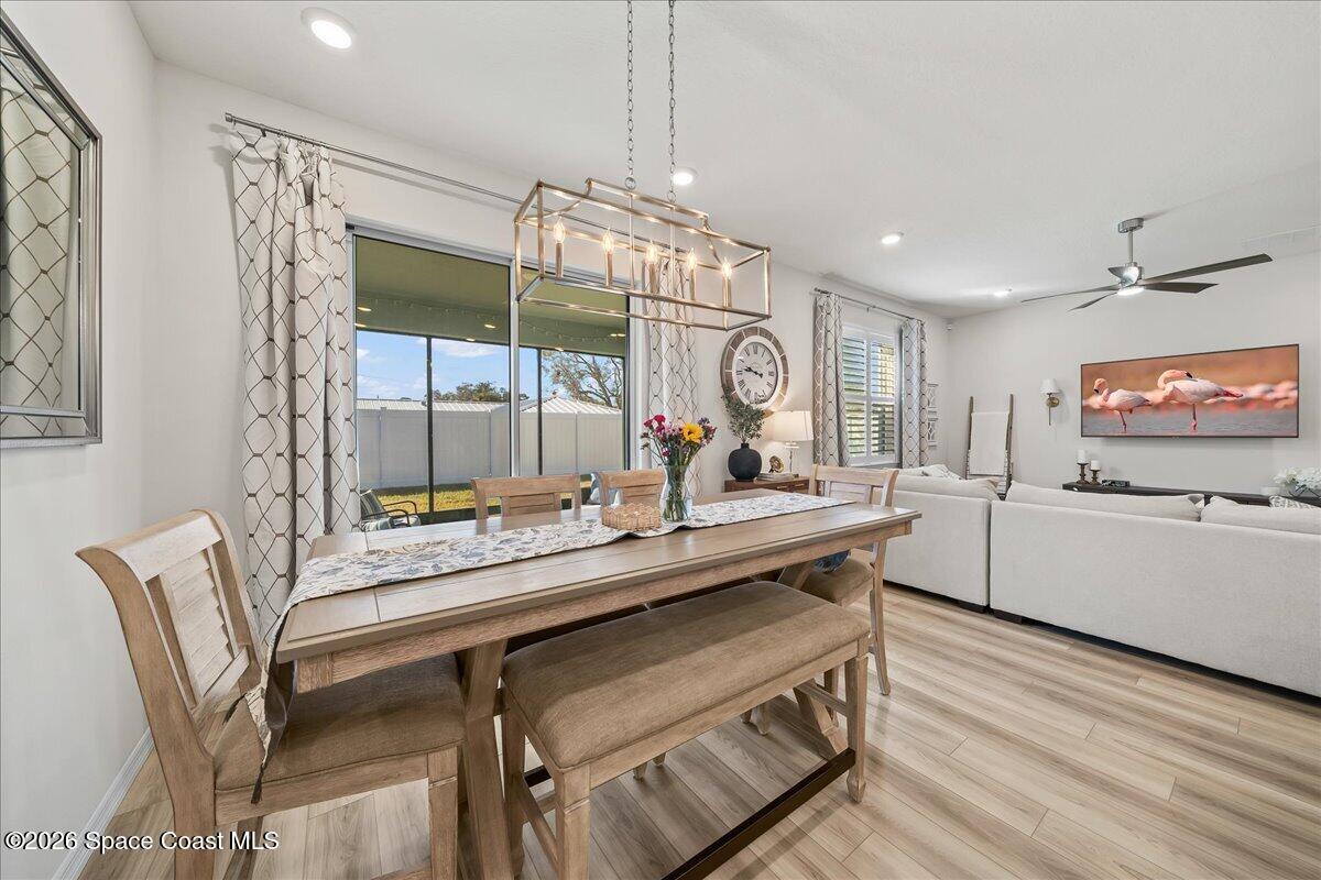 881 Covington Court Rockledge, FL 32955 - Photo 11 of 30 a kitchen with a table and chairs in it
