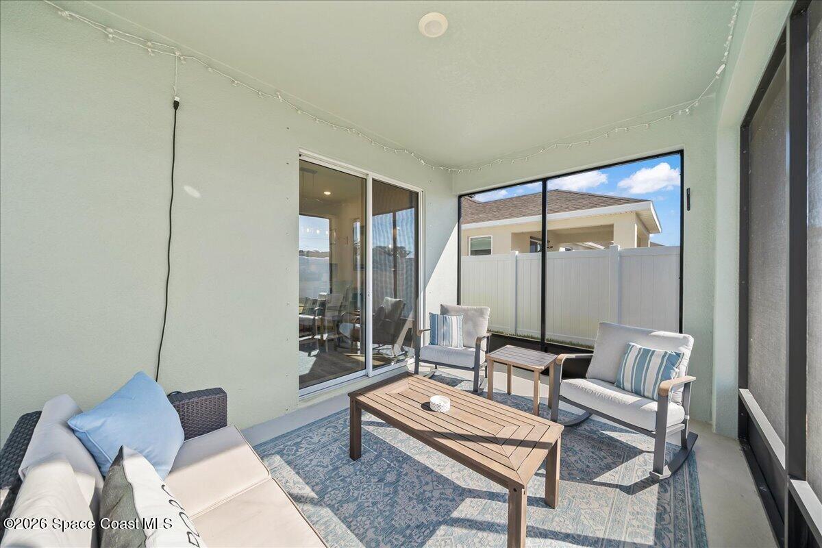 881 Covington Court Rockledge, FL 32955 - Photo 15 of 30 a living room with furniture and a large window