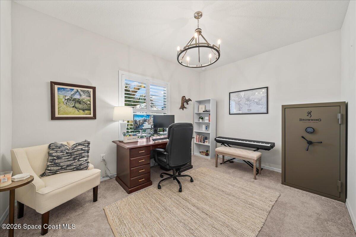 881 Covington Court Rockledge, FL 32955 - Photo 23 of 30 a view of a livingroom with workspace and a couch