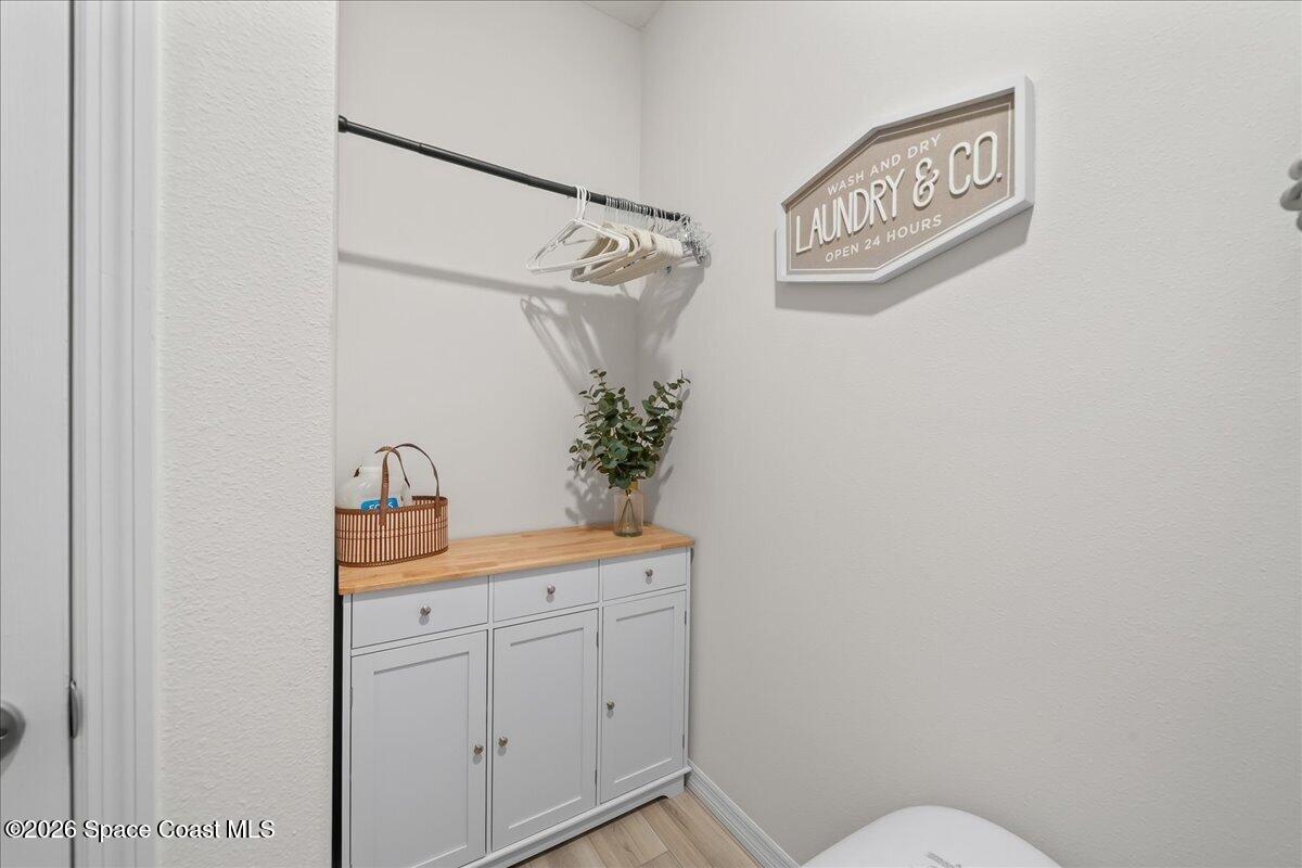 881 Covington Court Rockledge, FL 32955 - Photo 25 of 30 a bathroom with a toilet sink and vanity