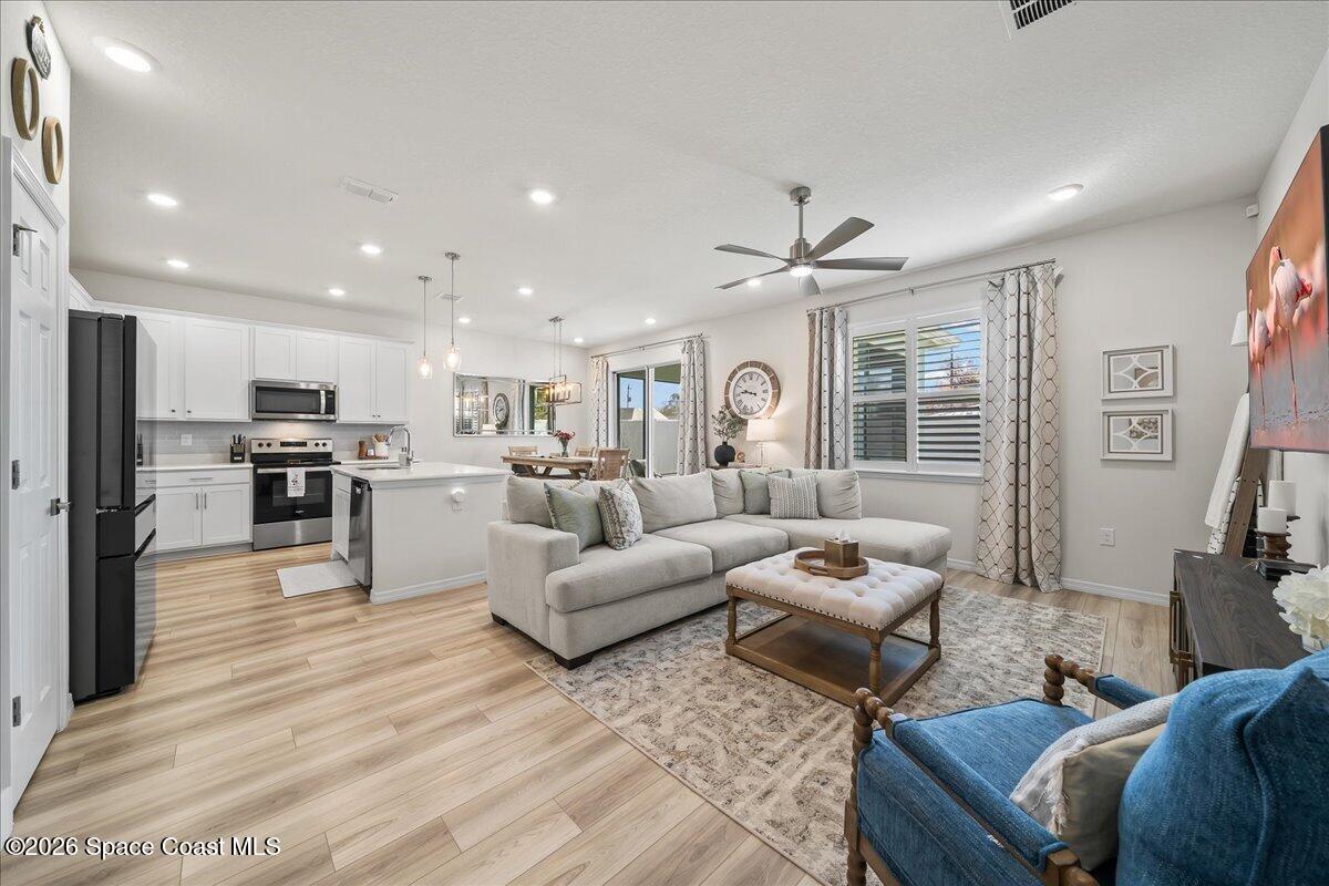 881 Covington Court Rockledge, FL 32955 - Photo 10 of 30 a living room with furniture and kitchen view