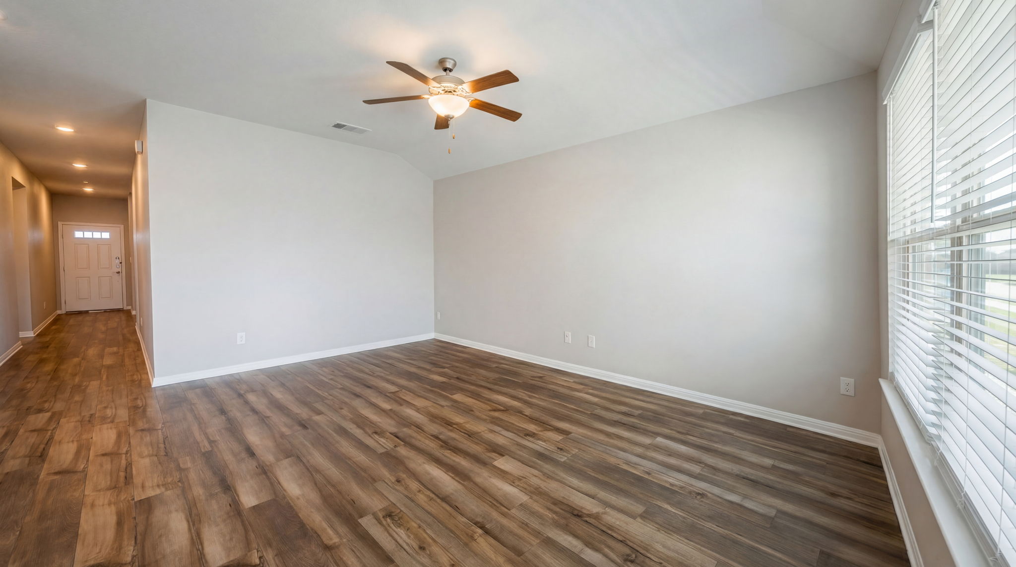 1003 Round Bale Road Hutto, TX 78634 - Photo 22 of 29 Spare room with healthy amount of natural light, ceiling fan, dark wood finished floors, recessed lighting, and vaulted ceiling